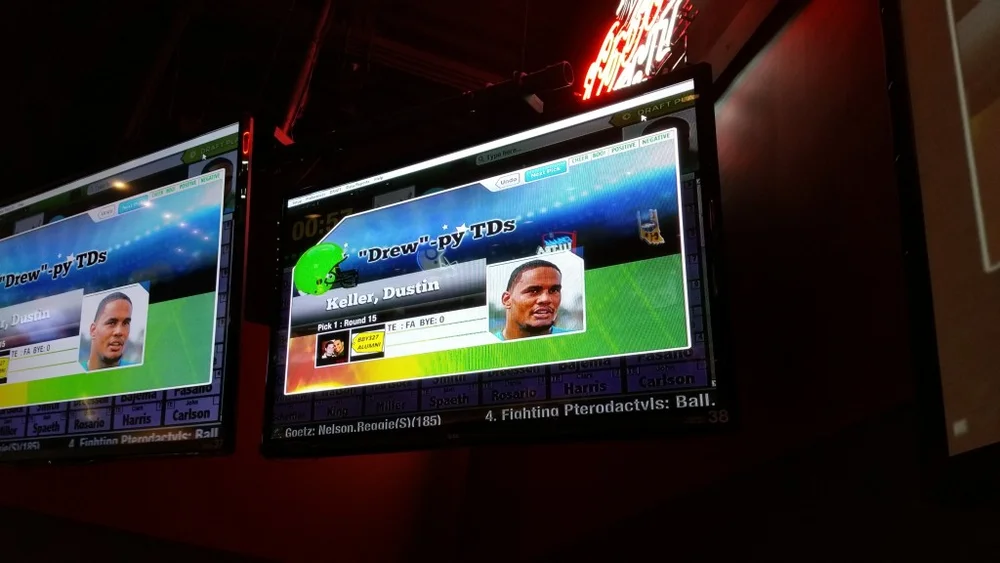 A FanDraft fantasy football draft party projected on a screen
