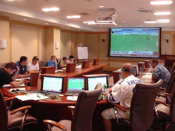 A FanDraft fantasy football draft displayed in a conference room